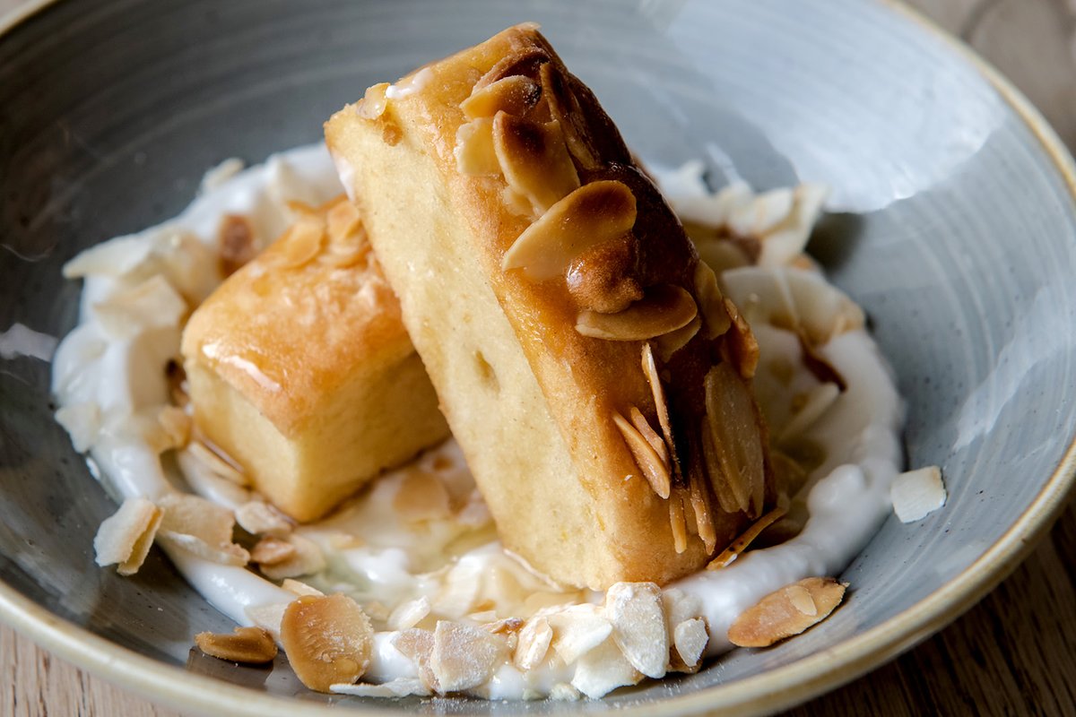 Our vegan lemon pound cake is a must-try on your next visit to The Milk House! Served with coconut yoghurt and sugared almonds, it’s a deliciously sweet way to indulge in citrusy sunshine on the plate.

#dessertlovers #dessertmasters #dessertheaven #dessertpic