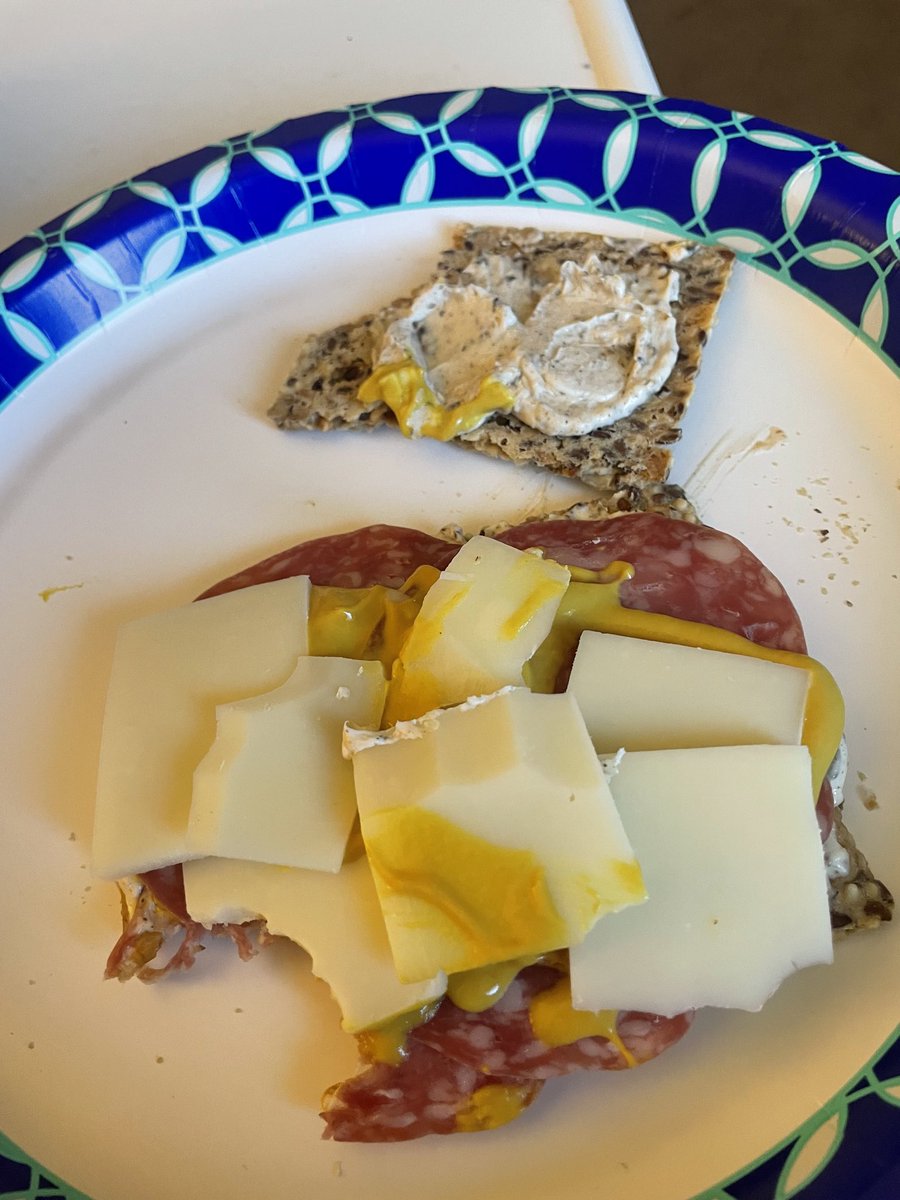 Norwegian crisp bread crackers, smear of cream cheese mixed with smoked paprika, three peppercorn pepper, and Trader Joe Umami spice.  4 small slices of Salami and Asiago cheese.  Yum 🤤