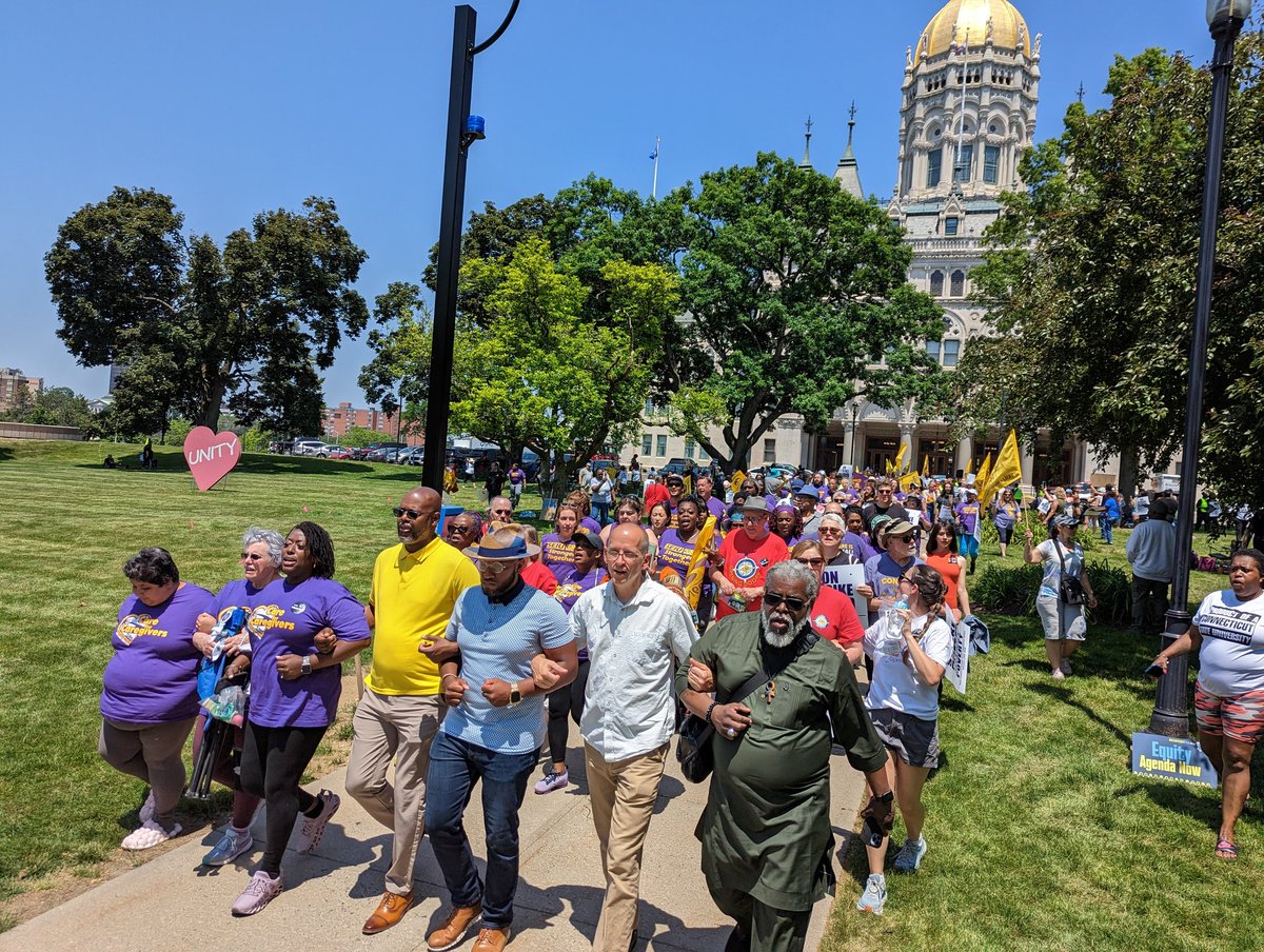 ConnAFLCIO's tweet photo. Faith leaders are leading activists &amp; strikers with @SEIU1199_NE in peaceful civil disobedience at the State Capitol to demand a #MoralBudget https://t.co/gpv346ybai