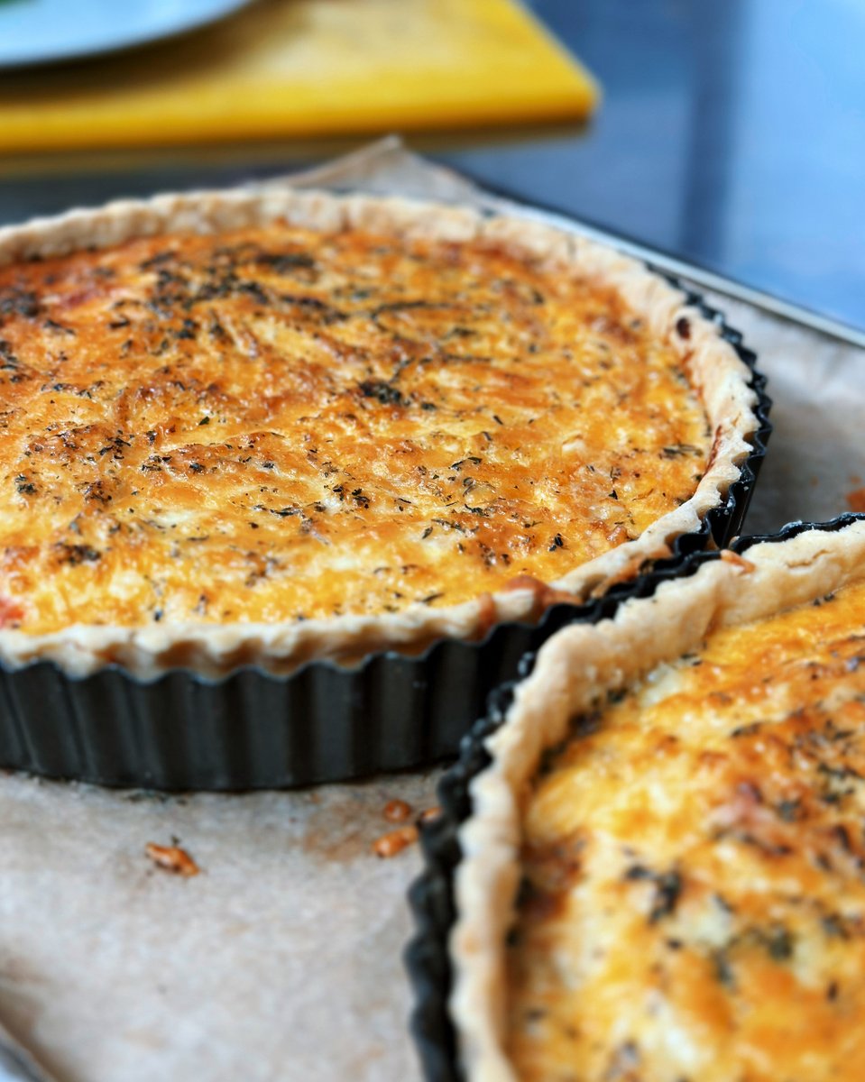 Cheese extravaganza alert: Three Cheese Quiche with Goat's cheese, Brie &amp; Cheddar, caramelised onions, and roasted peppers. Delight your taste buds! 🧀🤤