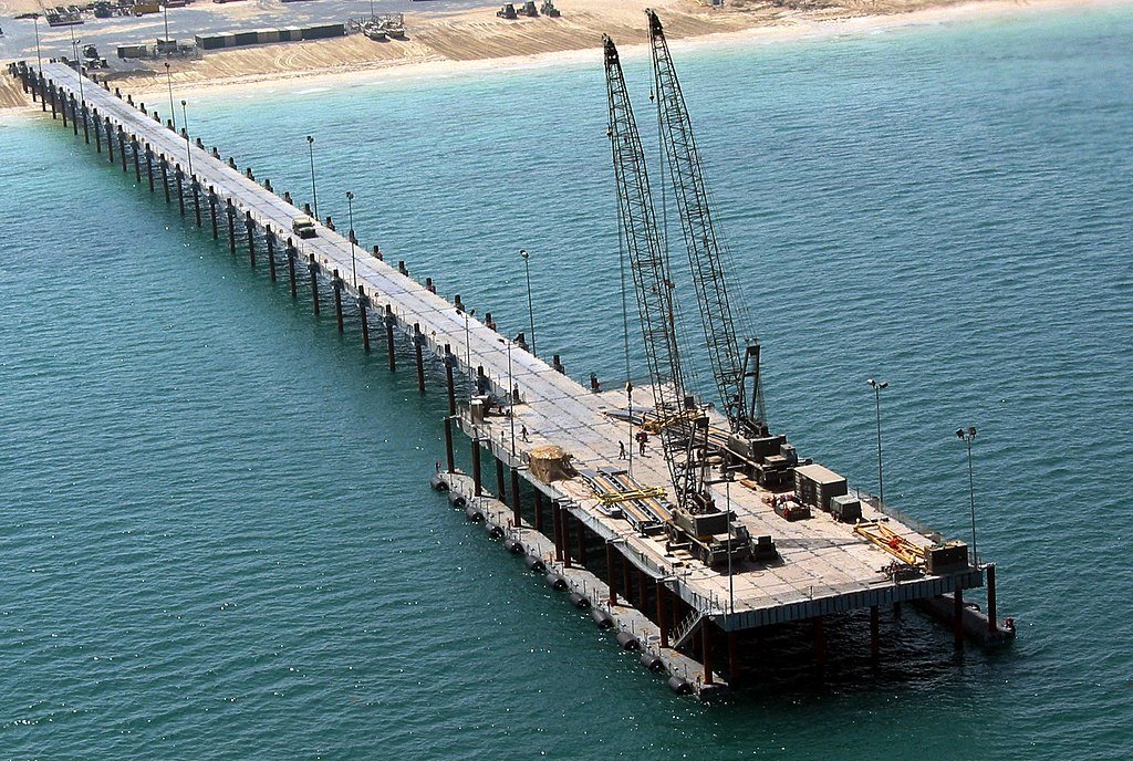 Piers for Use on Beaches

The US Navy Elevated Causeway System Modular, or ELCAS-M is a fantastic solution for loading and offloading lighters, without having a port.

Somewhat obscure, but that is why I like it!

Thread

1/