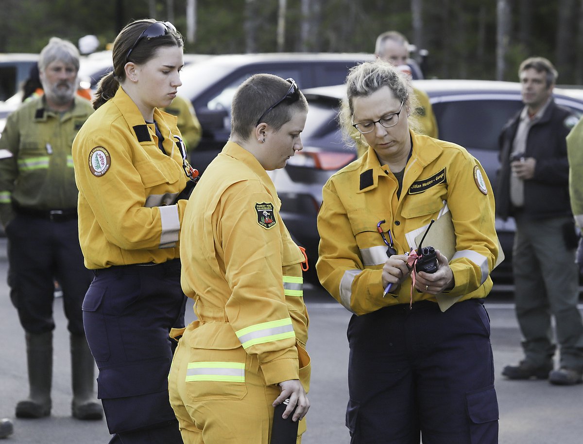 Pictures from the Barrington Lake, Shelburne County wildfire taken today, June 1.

-- Department of Natural Resources and Renewables' (DNRR) Jillian Weldon-Genge of East Lahave (right) signs in Mattea Miller-Evans of Merigomish (left) and Frankie Jacobs-Peters of Hantsport.