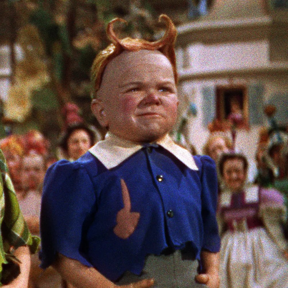 His stupid, stupid Munchkinland hair.