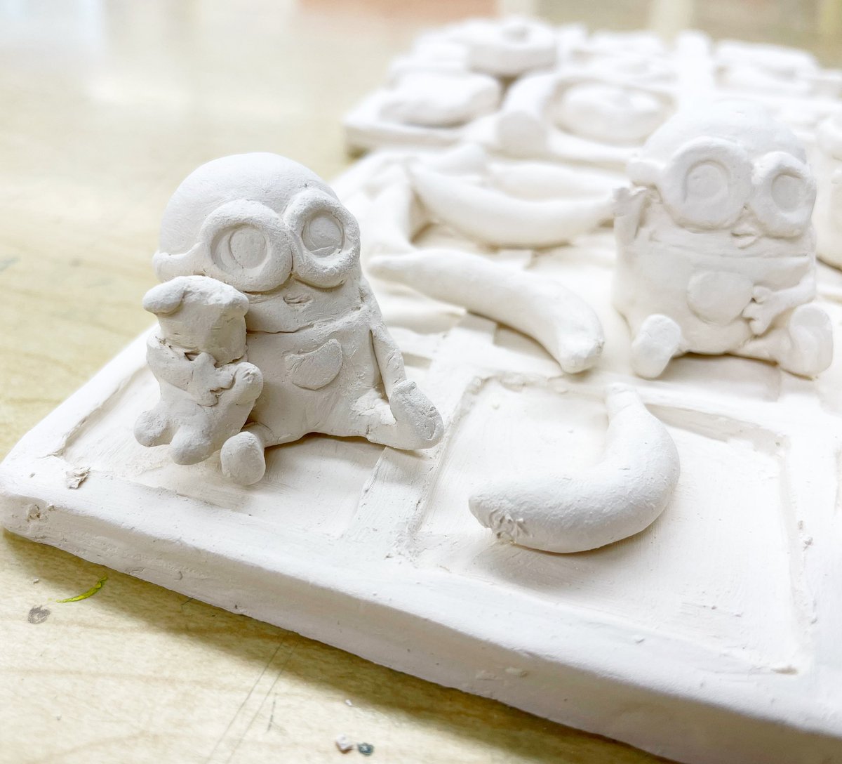 7th grade ceramic Tic Tac Toe Boards are coming out of the kiln and ready to be painted! I had to share a detail of this amazing set - Sanmayi sculpted minions vs bananas, and they are so intricate! 

#arted #arteducation #artsed #middleschoolart #REfreshREconnectREimagineXRDS