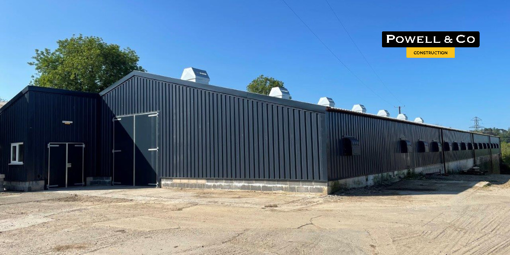 Powell_Ltd's tweet photo. Glorious sunshine in Devon as we near the completion of a free-range unit for a client. The timber framed unit is 170ft x 60ft x 8ft 6ins with a Goosewing Grey roof and Slate Blue sides. #freerange #poultry #nfupoultry #construction #devonfarming #poultryfarm https://t.co/Or6PToR5sN