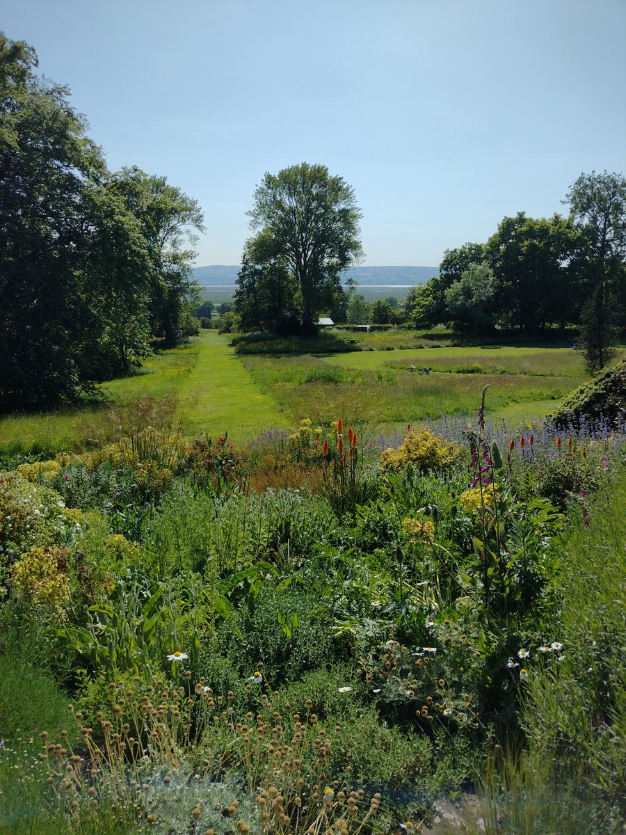 The Mediterranean Garden with distant views of #Wales @Ness_Gardens yesterday....just beautiful 😍