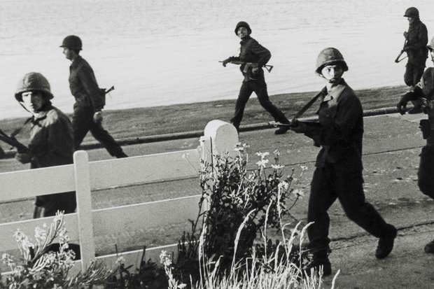 June 2nd 1982: Morning in Stanley sees Argentine soldiers on patrol along the harbour front before first light, lobbing grenades into the water and using searchlights, convinced that SBS Divers are in the area...