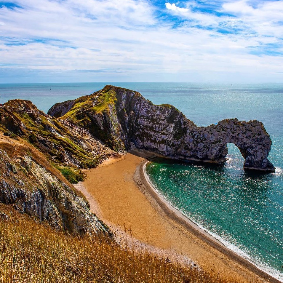 Durdle Door on the Jurassic Coast of Dorset, England was formed around 10,000 years ago by sea erosion, with strong waves forging a hole through the Portland limestone. The resulting iconic stone structure is a UNESCO World Heritage Site.

#EarthCapture by Joel Gray via Instagram