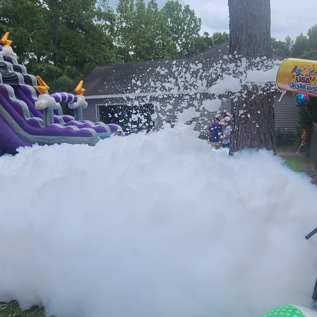 Ready for an unforgettable experience? Get ready to have the time of your life with an inflatable and foam party! Slide down the waterslide, dance in the foam and make memories to last a lifetime. #foamparty #waterslide
