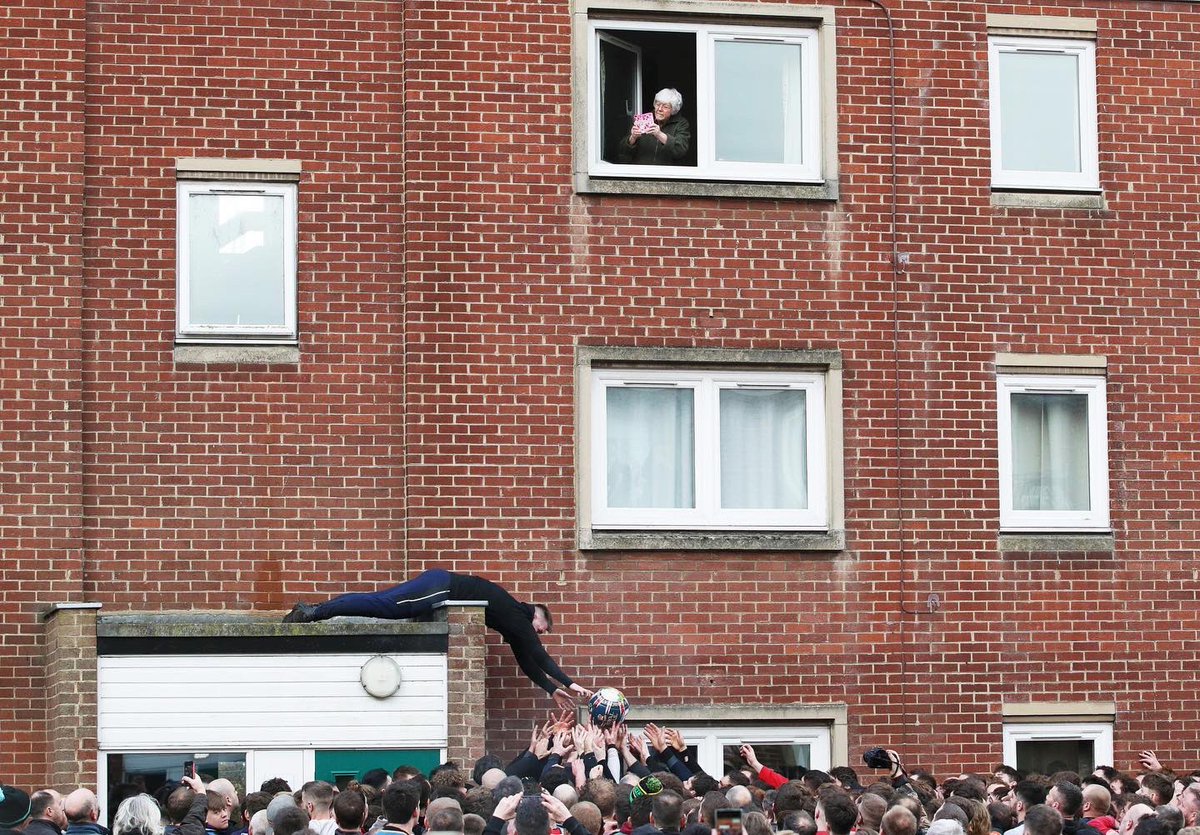 Rival teams the 'Up'ards and Down'ards' take part in the Royal Shrovetide Football match in Ashbourne back in February