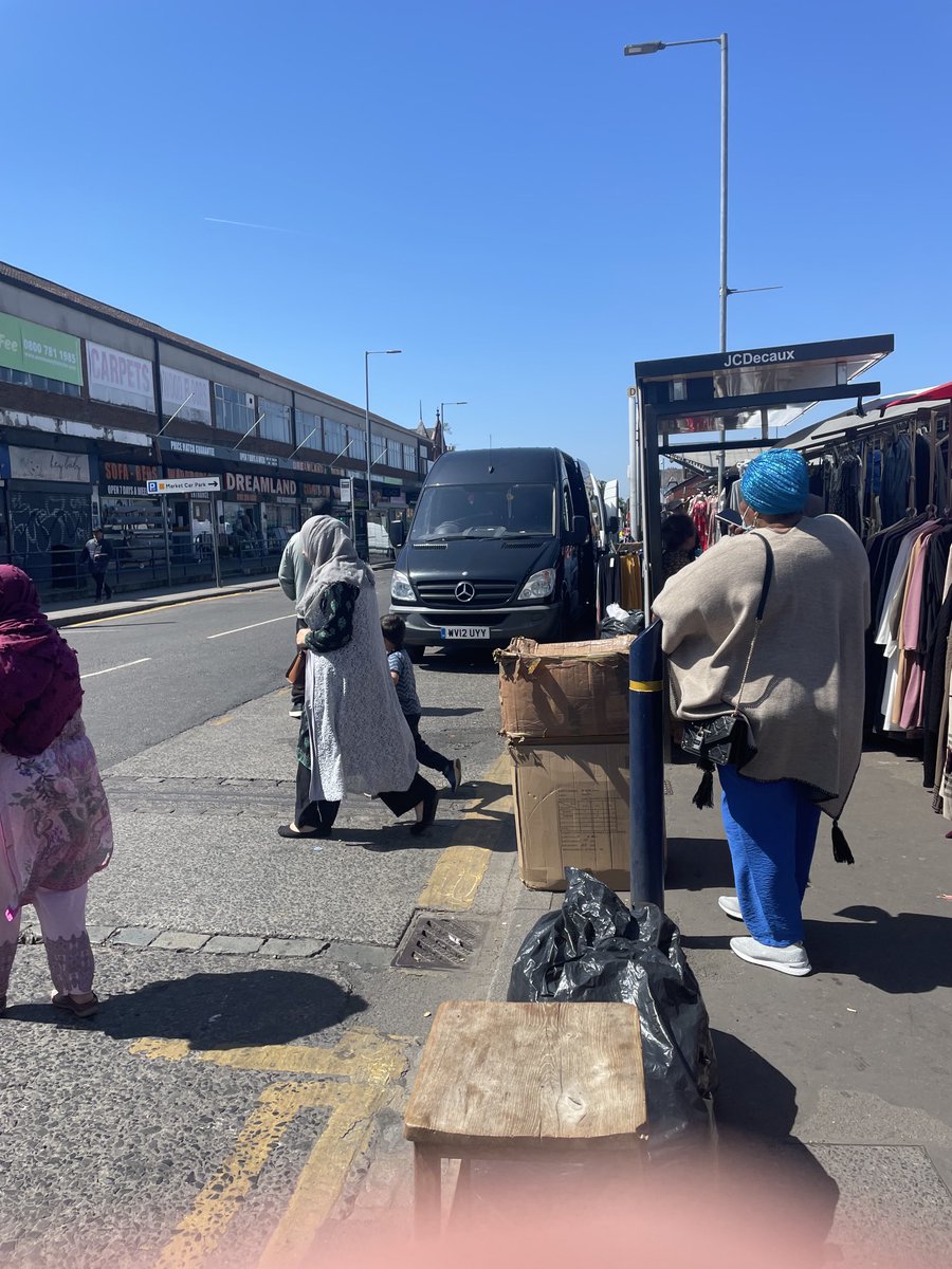Waiting for 53 outside Longsight market. Can you spot the bus stop ? market traders just use it as a another loading and unloading area. Please can you help ⁦@MCCLongsight⁩ ⁦@ManCityCouncil⁩ ⁦@OfficialTfGM⁩ .  By moving the bus stop or enforcement