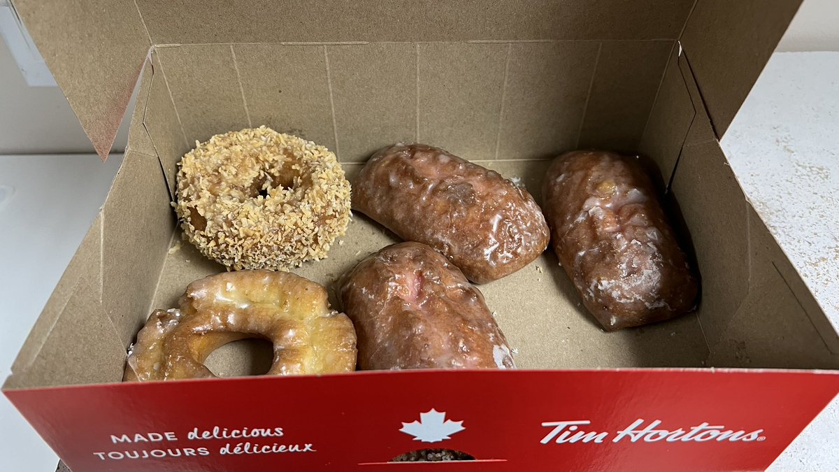 Torontovice's tweet photo. Happy #NationalDoughnutDay !! Brought some @TimHortonsin to work to celebrate. Not pictured is a #WalnutCrunch that was taken by a coworker. Which donut will you take next? 😂🤔 https://t.co/gMLrEgkPvn