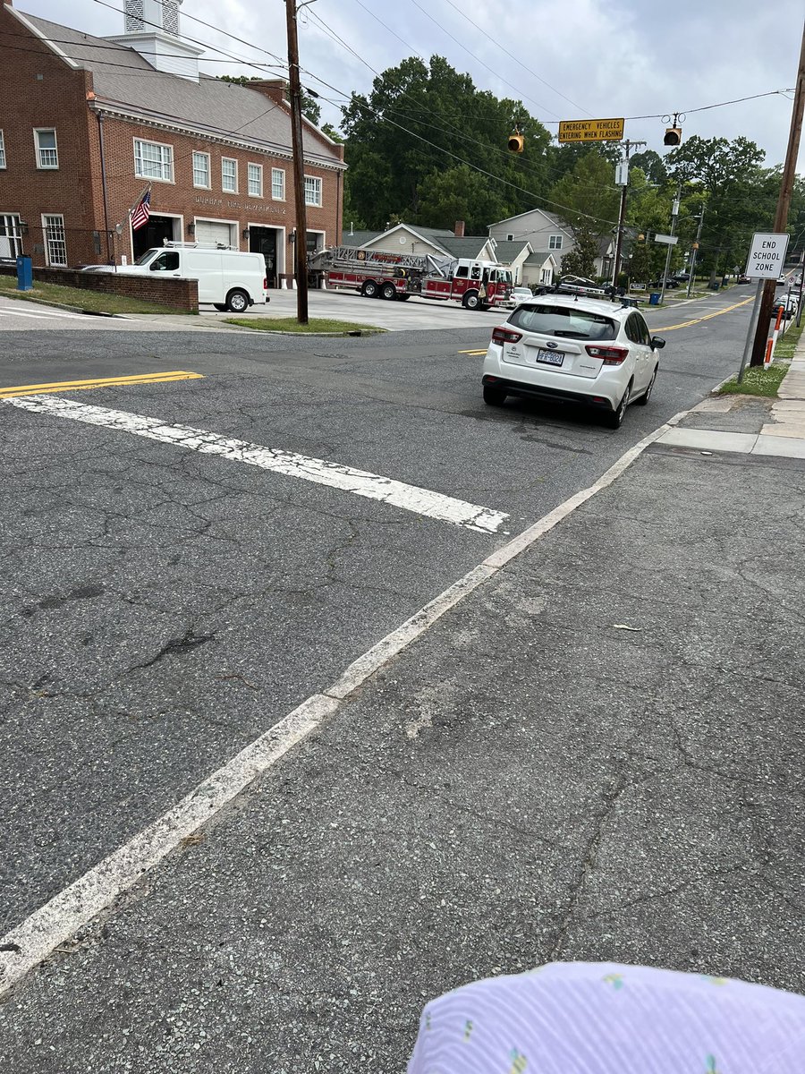 One of the most chaotic parking jobs I've ever seen. In front of a curb cut, in an intersection, across from a fire station, in a school zone and 10 yards from a no parking sign. Also, 3 feet from the curb, for good measure.