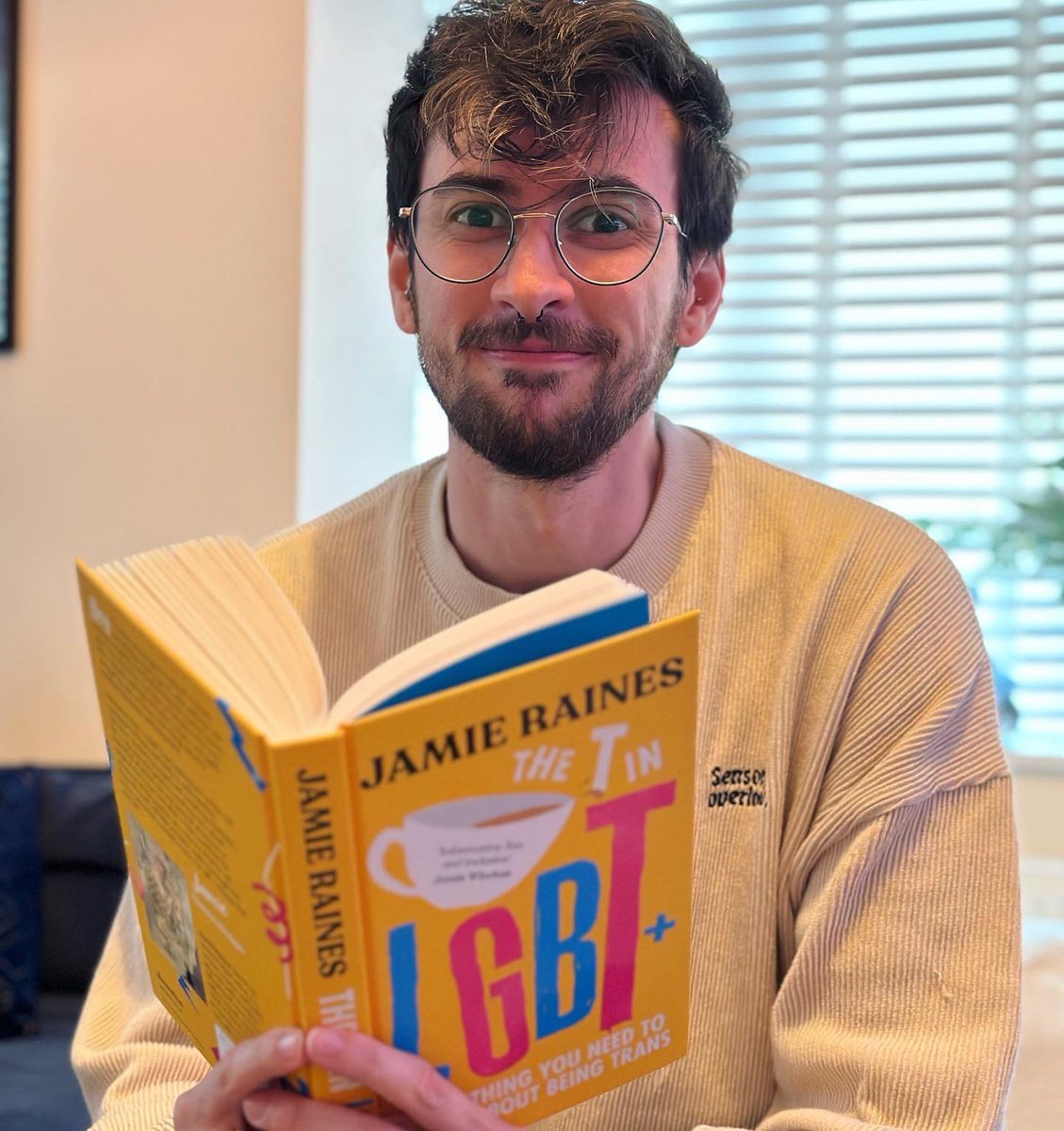 This is me holding an actual copy of my actual book. oh my actual god. The actual pre-order link for you to get an actual copy is in my actual bio 🏳️‍⚧️ #trans #book #transpride