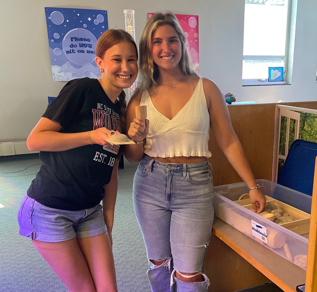 Seniors Maddie Weber and Rebecca Linn enjoying the sensory space in the library! #ClassOf2023 #SeniorWeek #Graduation