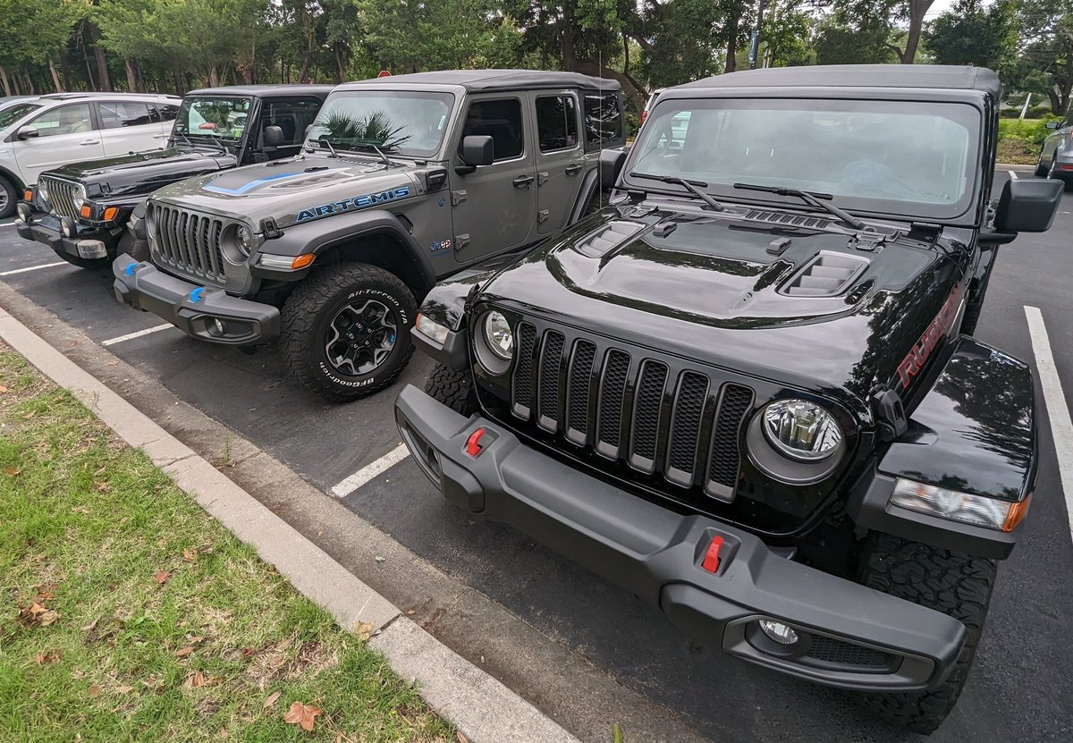 Love the sight of two jeeps side by side in a parking lot with a perfect gap in between! It's that 'jeep thing' to park alongside fellow adventurers. #JeepLife #ParkingPerfection