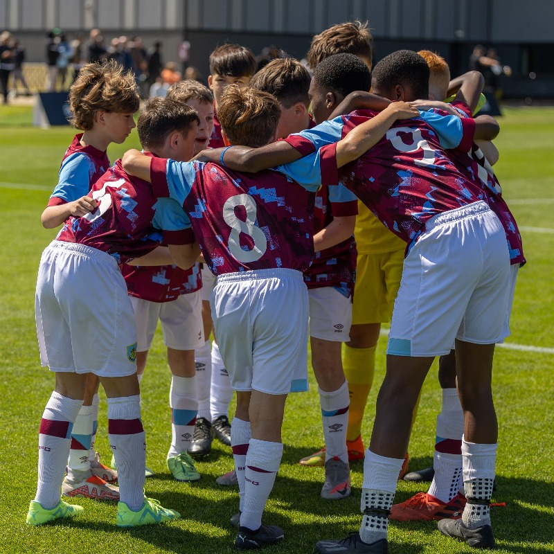BurnleyOfficial's tweet photo. A scintillating opening day of action in the sun at the training ground 🔥

Come along tomorrow to watch 16 of the world's best academy teams battle to win the Clarets Academy International Cup - there's free parking and free entry as well as refreshments on site 🍨