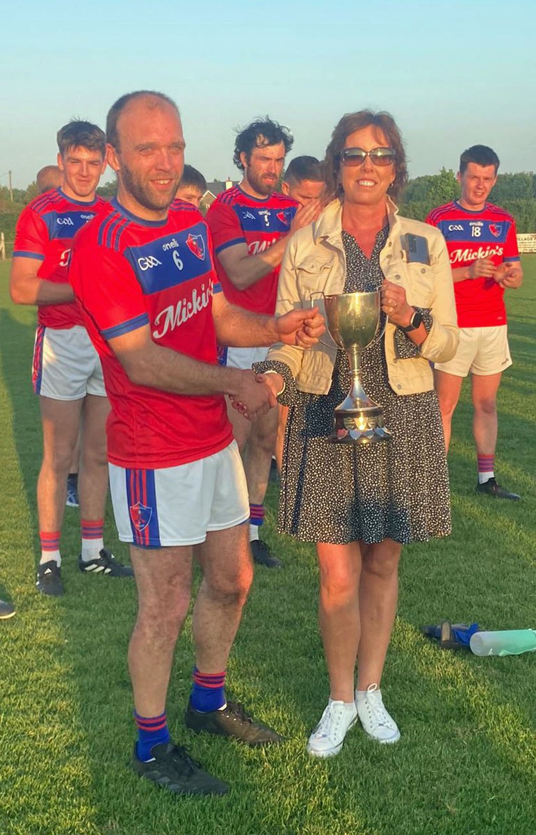 East Cork Junior 2 Football League Final in Castlemartyr this evening.  Full Time: Erins Own 4-8 Fr O'Neills 3-7.  Photo shows Ms Avril Geary, Cathaoirleach Roinn Oirthear Chorcaí presenting Pat Fitzgerald Capt Erins Own with the trophy.