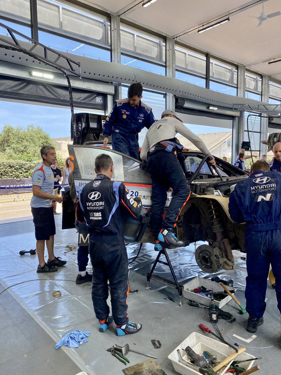 This is rallying summed up in a few photos. Crash your car and then help the team fix it, brilliant team work from Dani and Candido to help their Hyundai team rebuild their car. You bend it you mend it.