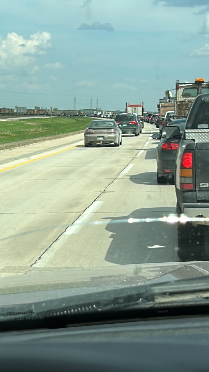 A train stopped on the perimeter highway at 4:30 pm. This is great ⁦<a href="/MBGov/">Manitoba Government</a>⁩ highway planning. Great job. #bullshit