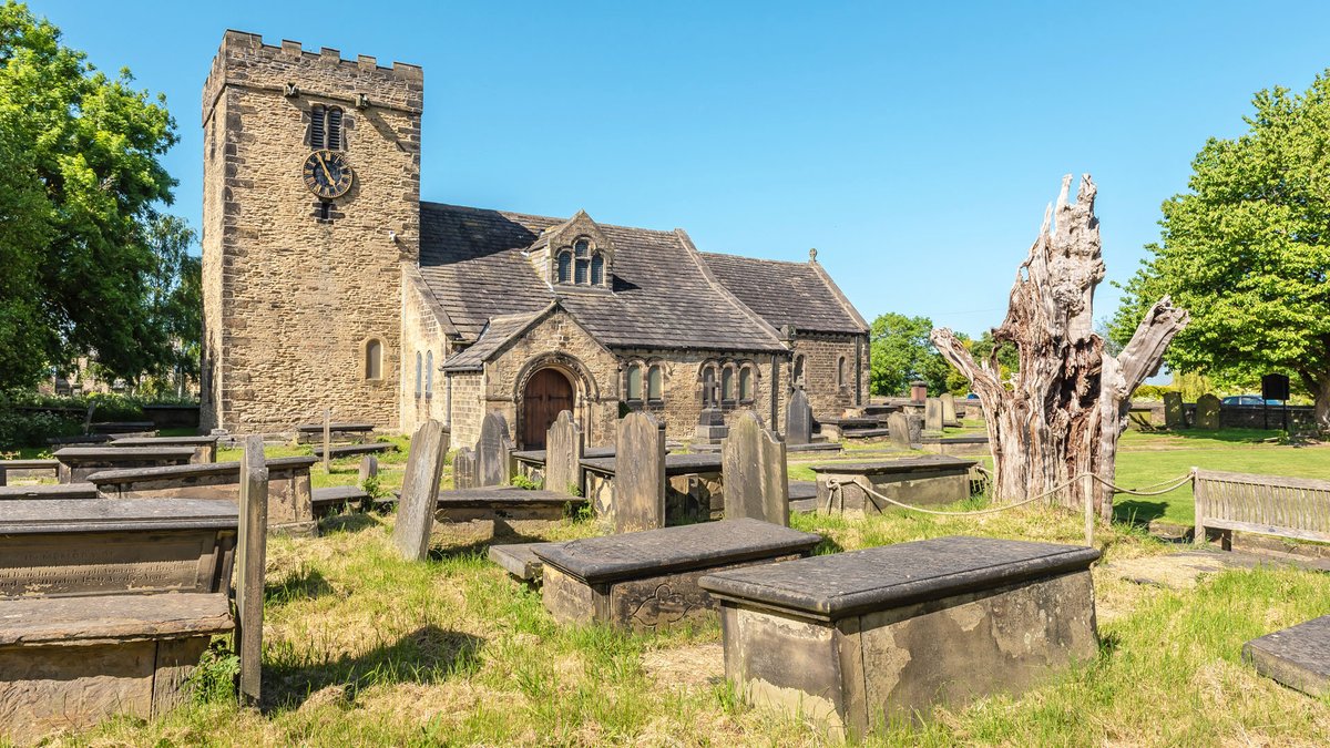 St Peter's Church, Hartshead, has connections to the legend of Robin Hood, who is reputedly buried in the grounds of nearby Kirklees Priory. It is said that he cut wood from the yew tree (the stump on the right) to make the arrow he shot to mark where his grave should be dug.