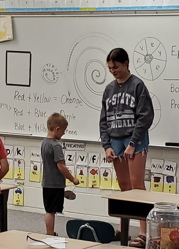 We are working hard in summer school. We are also having some fun learning. Last Friday, we learned about force and practiced using a ruler while making domino runs. Today we reviewed some geometric shapes while making spinners. And our birthday boy brought some popsicles.