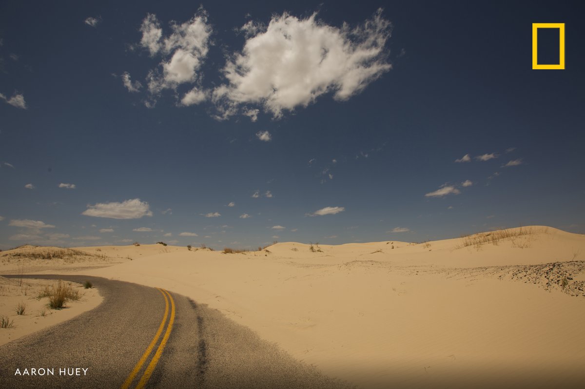 Sand dunes covering the road in Monahans Sandhills State Park near Odessa, Texas.