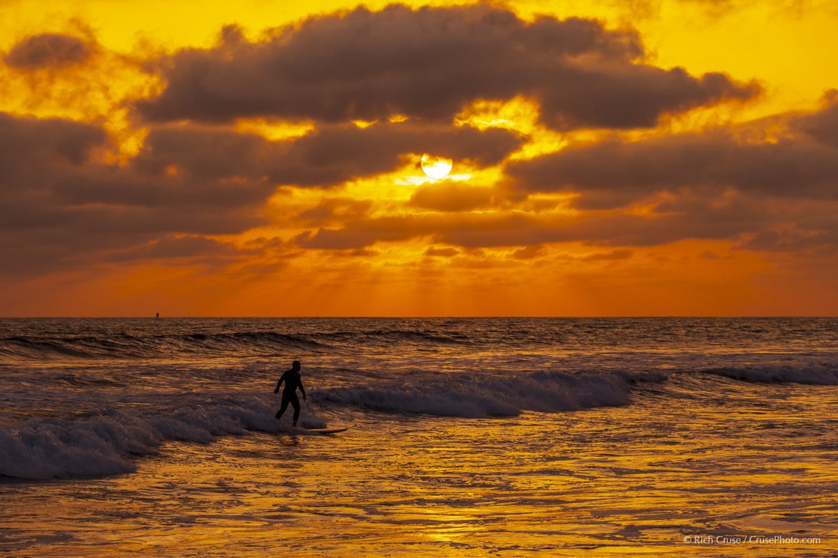 A surfer at #sunset in #Oceanside. June 2, 2023 @VisitOceanside @visitsandiego @VisitCA #StormHour #ThePhotoHour #CAwx #SanDiegoWX #NikonCreators @NikonUSA #VisitSD #Surfing