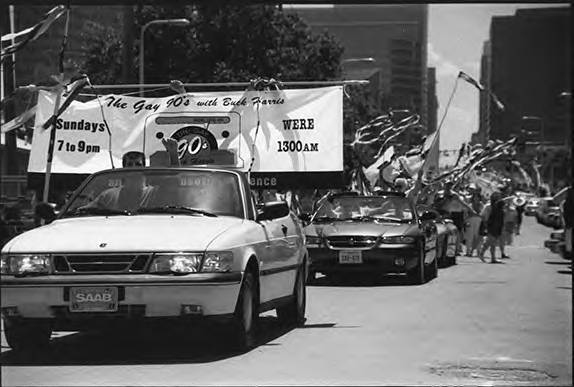 SkrticX's tweet photo. 1996 Cleveland Gay Pride March, showing a car sponsored by The Gay 90's with Buck Harris. The driver has a fist raised, while a sign showing The Gay 90's' time slot, AM frequency, and one of their slogans (An Out of Closet Experience) is held up behind him by riders. #clepride https://t.co/SJIPYgeNc5
