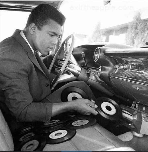 Muhammad Ali playing 45s in his car.