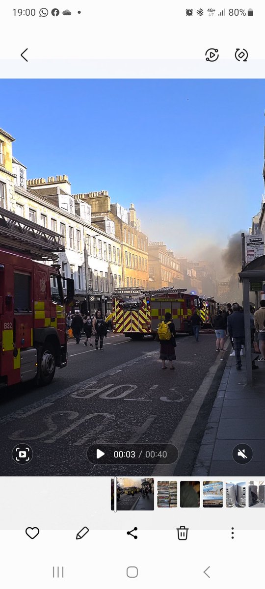 Big Fire smoke bellowing MultiFire Police Ambulance vehicles arriving in South Bridge Edinburgh above PDSA shop Hope all people OK