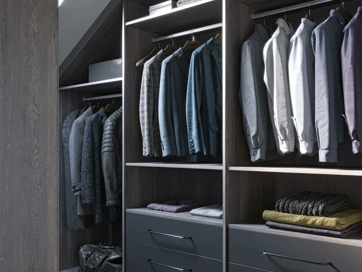 kleiderhaus's tweet photo. Upgrade your loft bedroom with a sleek fitted walk-in wardrobe! Our bespoke design, featuring walnut and lacquered dark grey doors, is perfect for sloping ceilings.  With LED lighting, double hanging rails, and ample storage, it's a dream come true.  https://t.co/I0AZq2CpL6 https://t.co/lxOJXuGUZ7