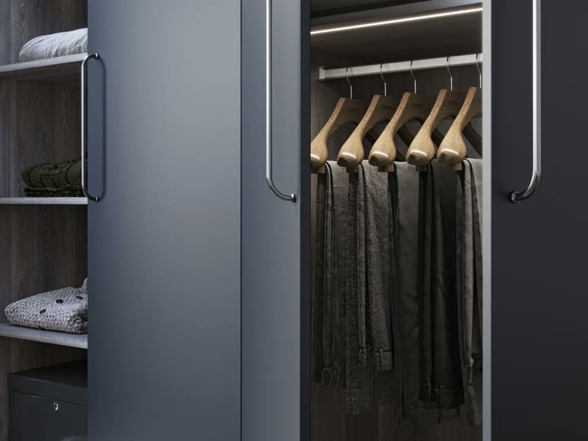 kleiderhaus's tweet photo. Upgrade your loft bedroom with a sleek fitted walk-in wardrobe! Our bespoke design, featuring walnut and lacquered dark grey doors, is perfect for sloping ceilings.  With LED lighting, double hanging rails, and ample storage, it's a dream come true.  https://t.co/I0AZq2CpL6 https://t.co/lxOJXuGUZ7