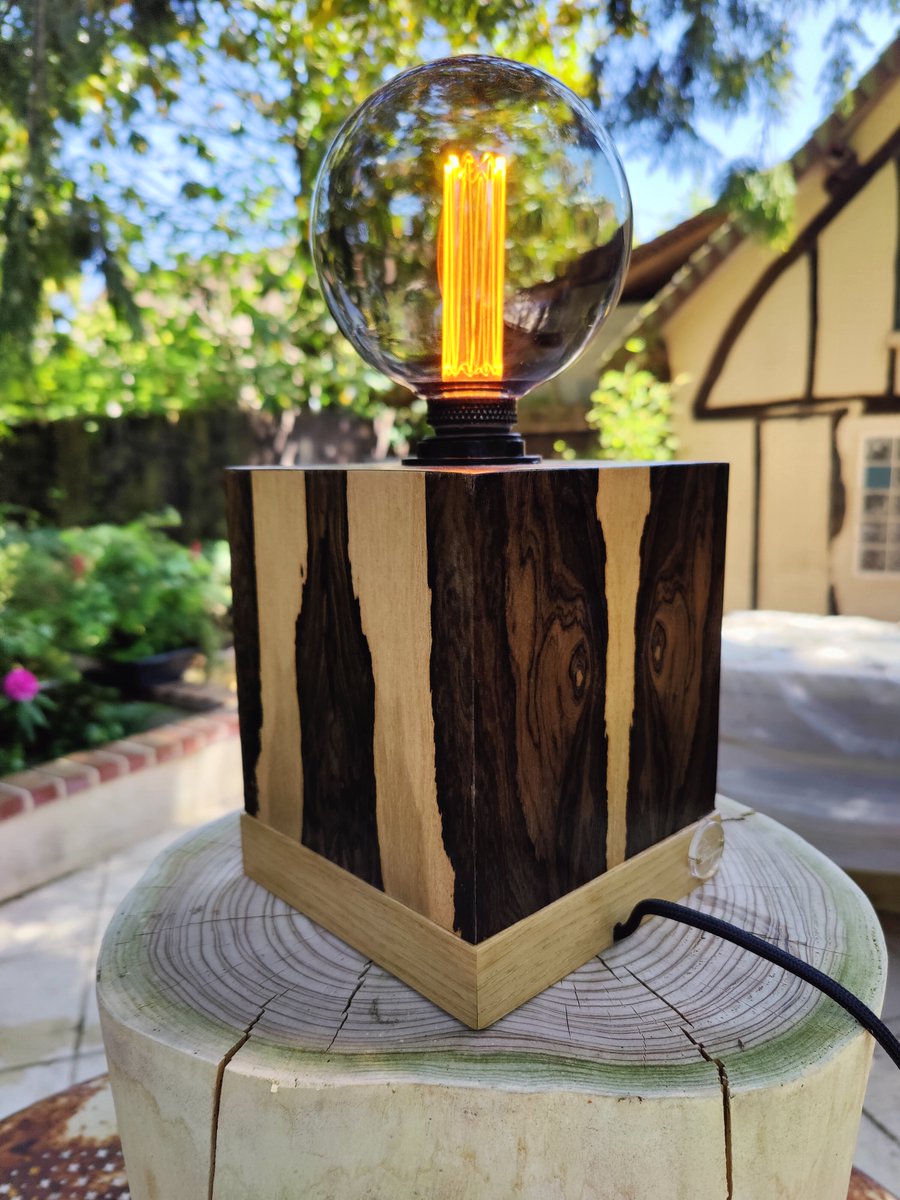 Labo_Voluptas's tweet photo. Lampe bois ébéniste "Dupetit Thouars" Lampe à poser d'ambiance. Composée de cinq carreaux plaqués Ziricote sur une base en chêne naturel #lampebois #luminairebois #lampeebeniste #woodworking #ziricote #madeinfrance #fabriqueaparis https://t.co/VBSsytaZ6B
