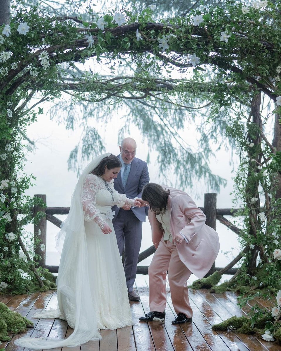 equallywed's tweet photo. We're a wee bit obsessed with all the gorgeous details from power couple Beanie Feldstein and Bonnie-Chance Roberts' lakeside wedding, including their custom @gucci attire. All photos by @corbingurkin.⁠ More on https://t.co/WM6DIp84CT. https://t.co/JmVCKVinwH