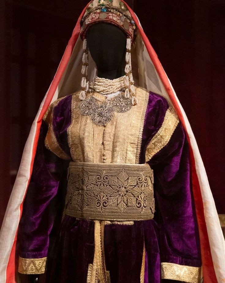 Rabat Costume composed of it's velvet & gold thread embroidery Caftan, Hzam and Toubiqa exposed in Oudaya Museum of Rabat, Morocco.