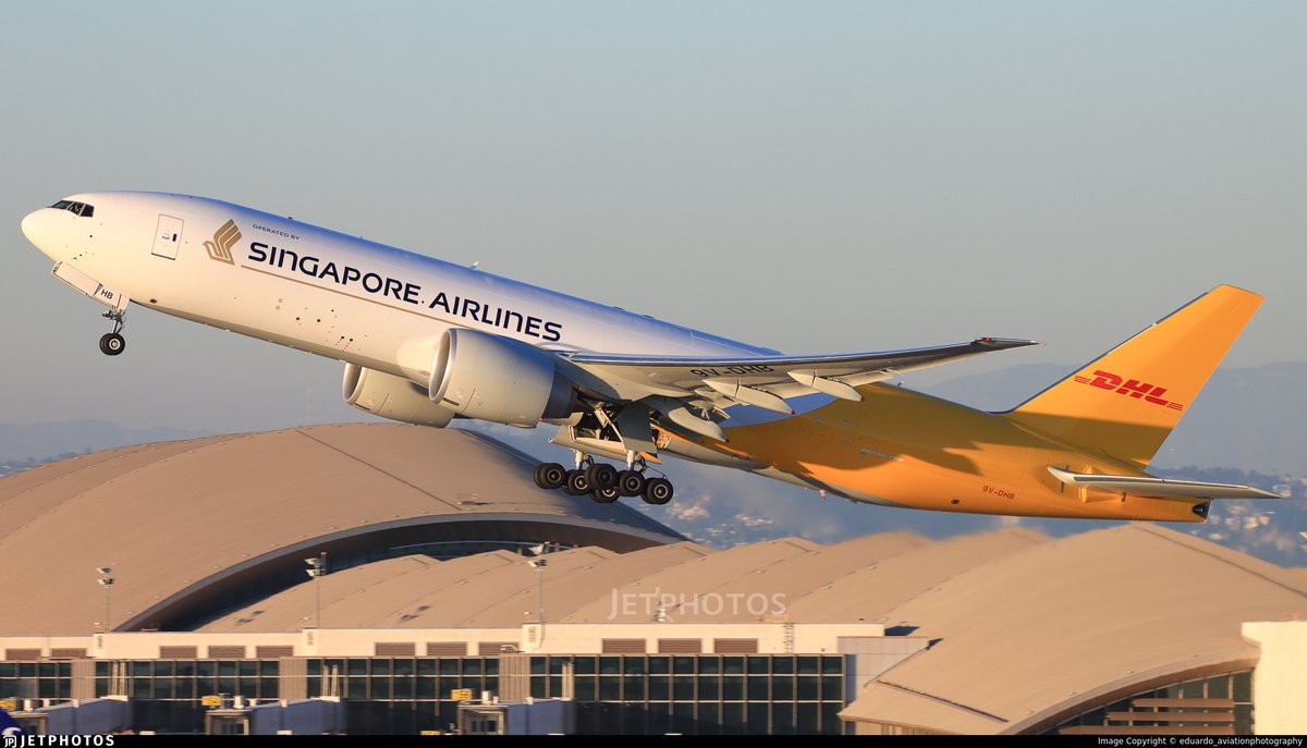 A Singapore Airlines Cargo 777 in hybrid DHL livery departing Los