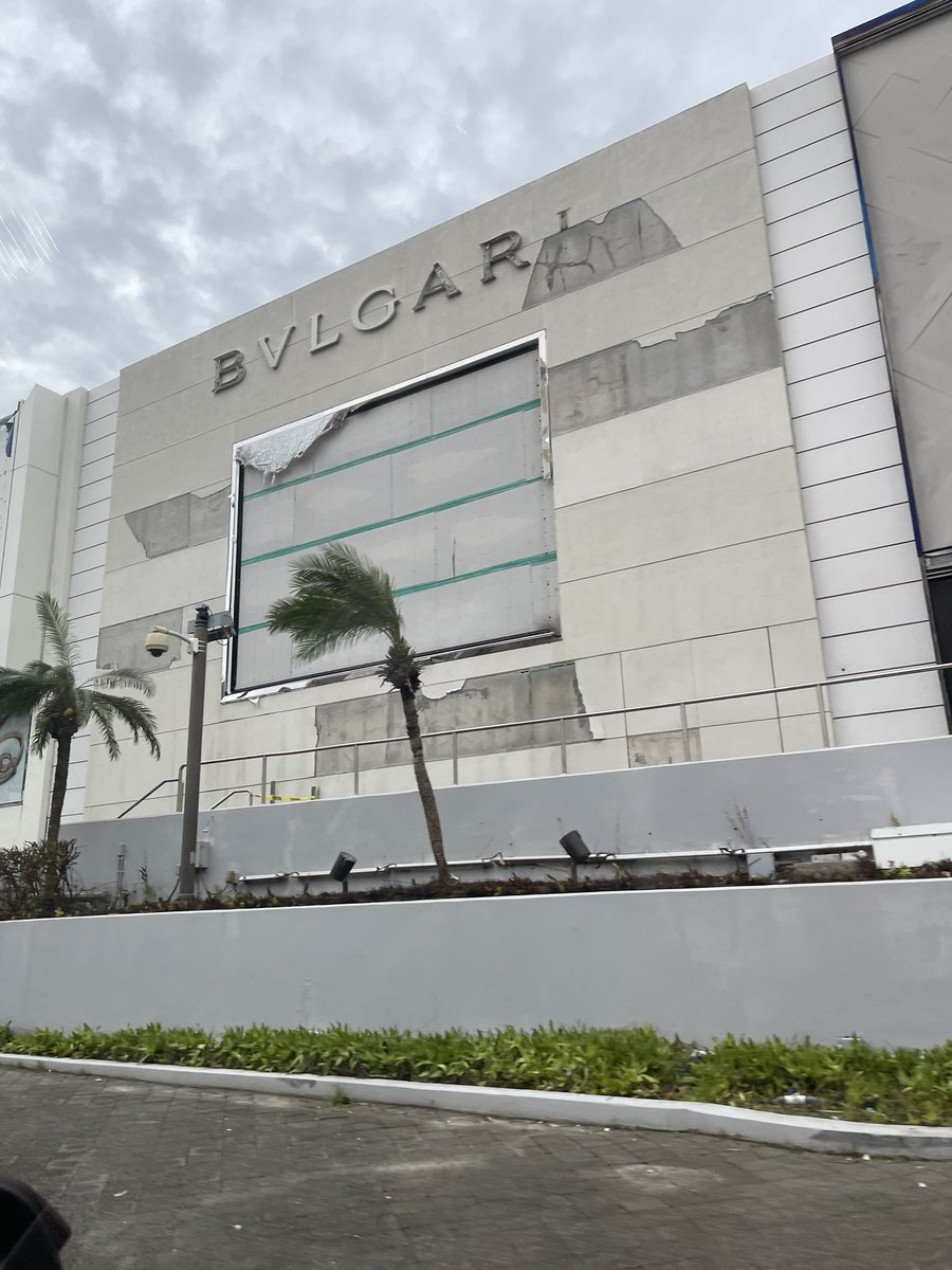 GU671dotcom's tweet photo. T-Galleria in Tumon, Guam. Brand signage shredded by #Mawar #TiffanyAndCo #LouisVuitton #Bulgari #Prada and more. 💔🖤 https://t.co/goiottMRql