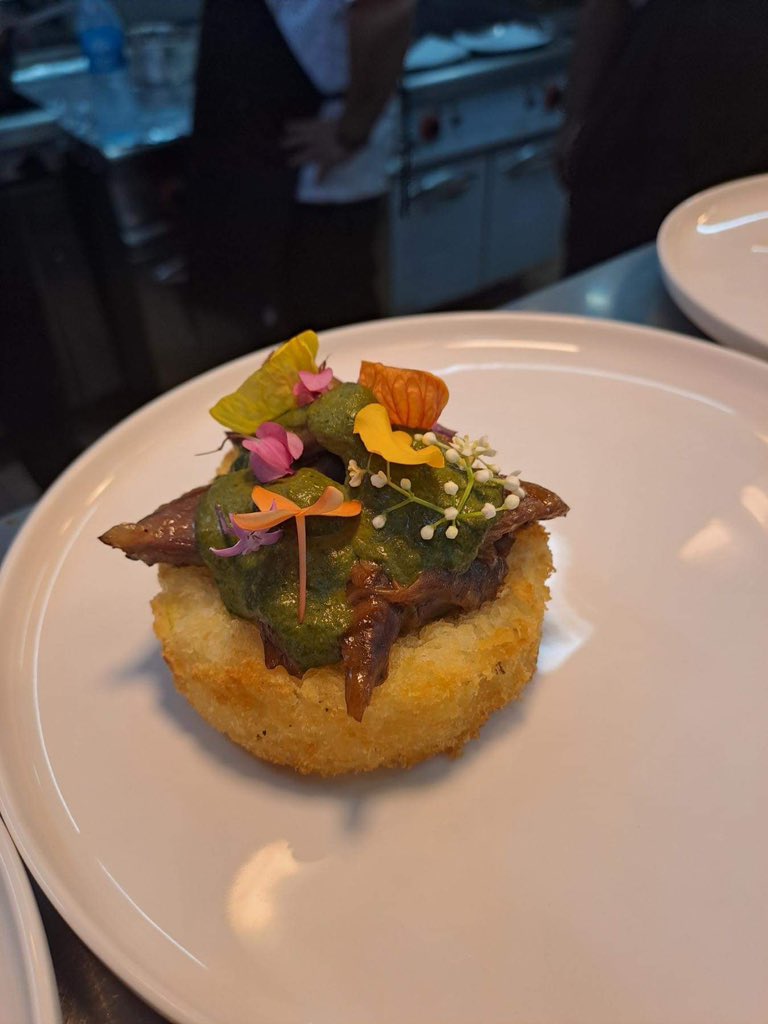 A modern twist to the infamous 
Lamb rourou with Cassava 
Garnished with Edible flowers