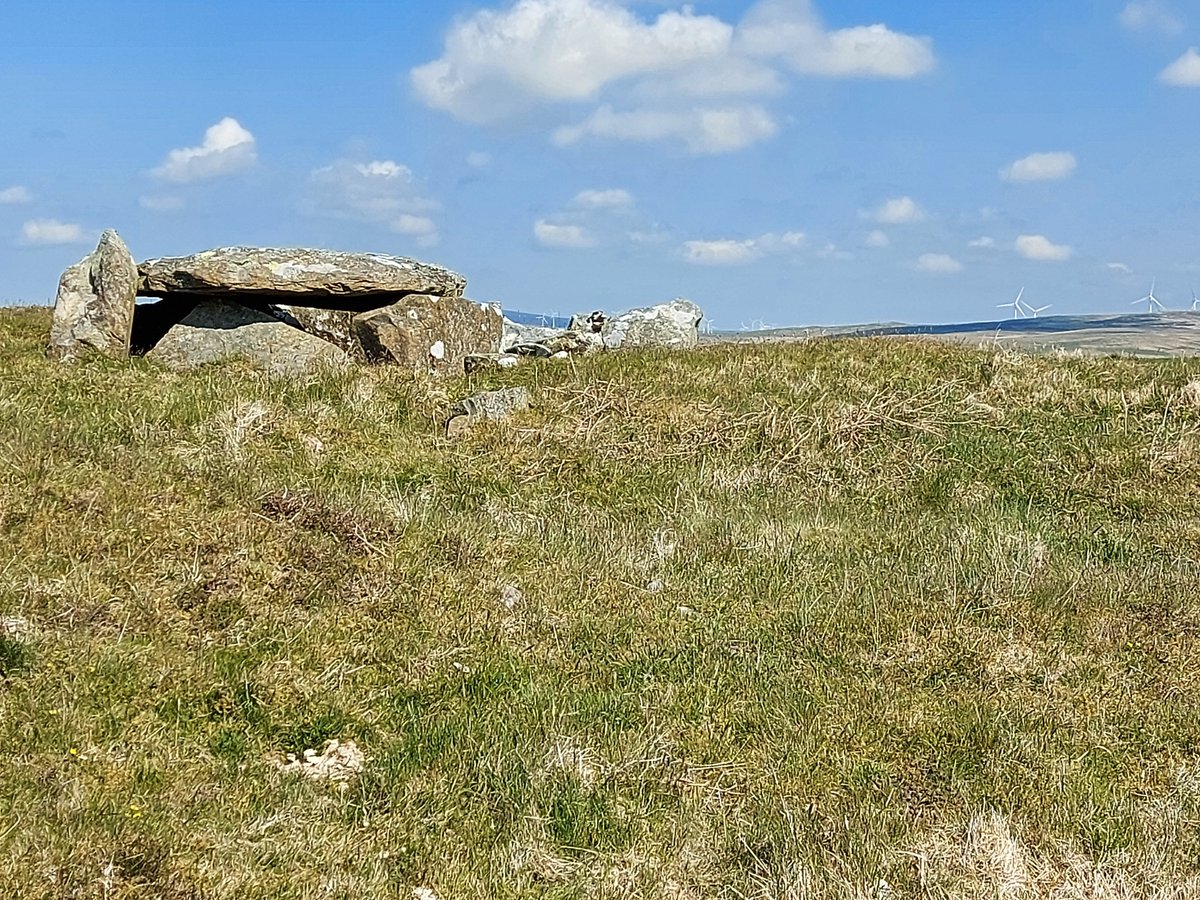 The placename has been translated as meaning “hollow of the cairns” - suggesting it was also a burial site. Certainly, the wider landscape here is peppered with prehistoric sites such as the Caves of Kilhern chambered cairn (shown here), a few miles to the SE.