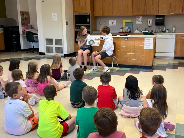 Kindergarteners visited the Creekside garden to learn about the importance of worms and to plant their own seeds.  Sixth-grade students read them a story and gave them tours of the kitchen classroom and the gardens.