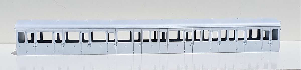 wrt_77's tweet image. Start of my #Bachmann #Class116 project. Trying a TC cut n shut with moderate success. DMBS &amp;amp; DMS has a coat of primer to highlight areas for further work. Mods are Dapol Dome, shell roof vents, filling side vents, thinning front &amp;amp; removing window frames #TMRGUK