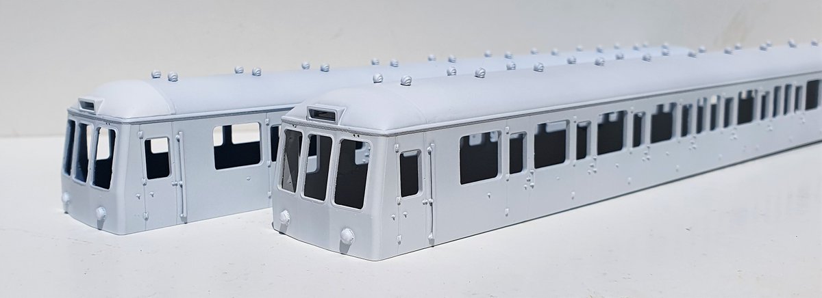 wrt_77's tweet image. Start of my #Bachmann #Class116 project. Trying a TC cut n shut with moderate success. DMBS &amp;amp; DMS has a coat of primer to highlight areas for further work. Mods are Dapol Dome, shell roof vents, filling side vents, thinning front &amp;amp; removing window frames #TMRGUK