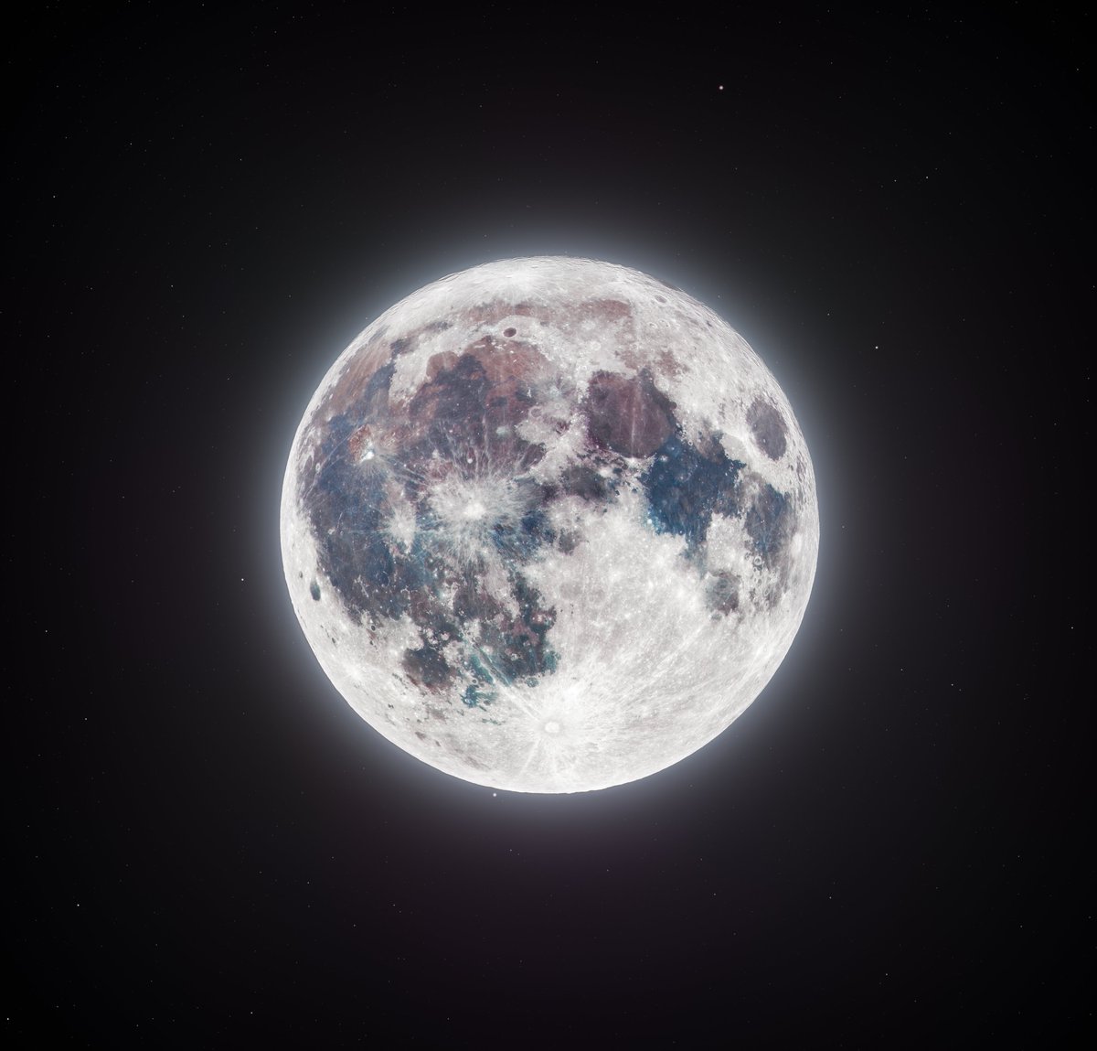 Last night I captured an 85 megapixel photo of our moon by using two telescopes and two cameras. Check out the details up close! The color is real, but much more subtle to your eyes. Increasing saturation reveals the rich geological history of our moon!