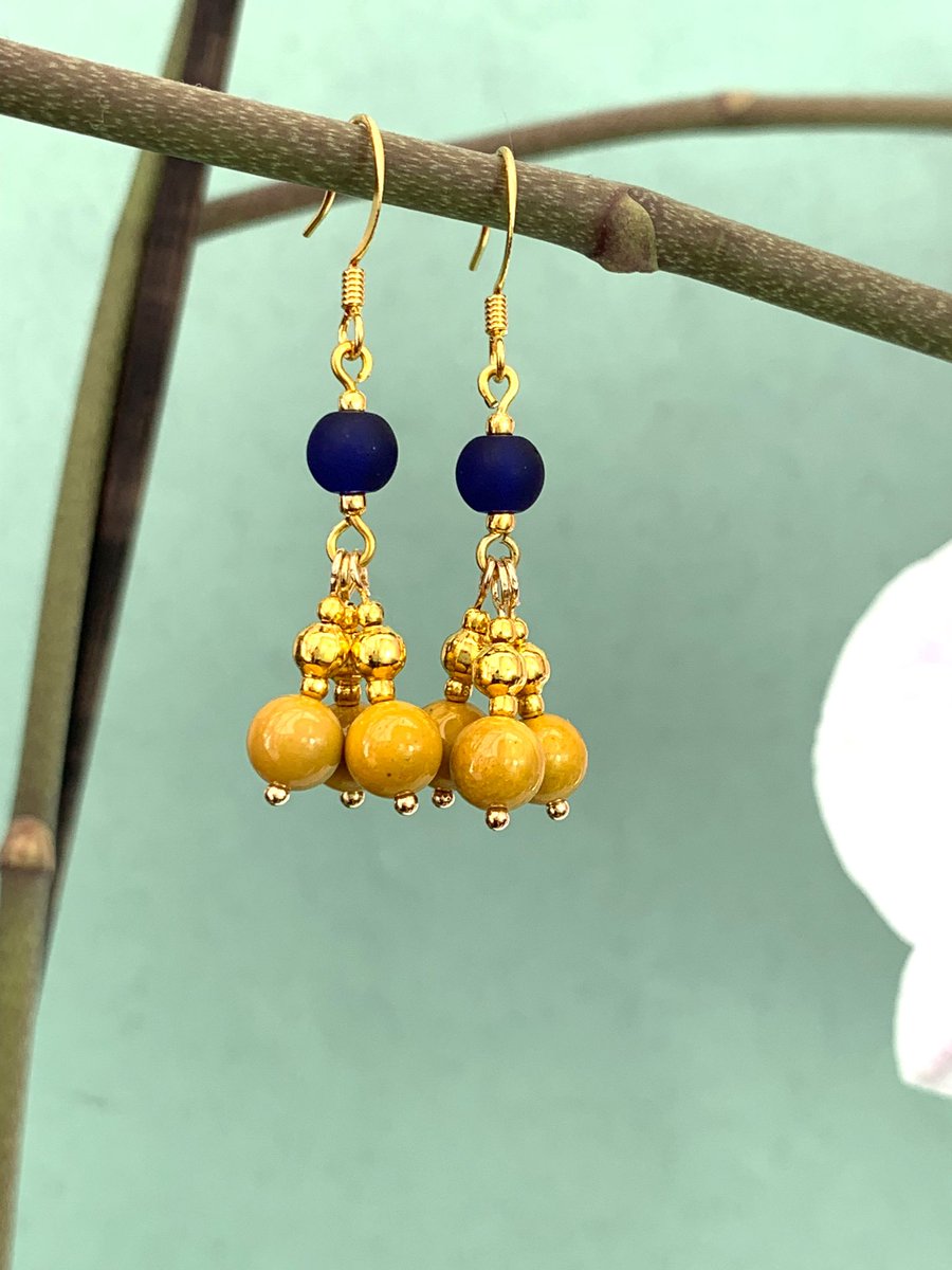 Dark Blue Sea Glass and Mustard Yellow Mookaite multi beaded boho style  gemstone earrings. Available via Etsy. #mookaiteearring #madeinwales #bohogemstone #handmadeboho #pairofearrings 

etsy.com/uk/listing/149…
