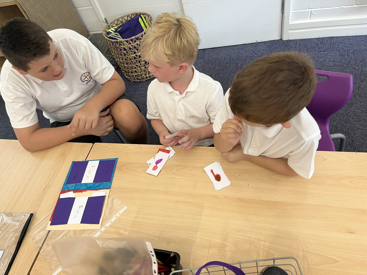 Emmaus_School's tweet photo. 💜Year 2 are enjoying playing some maths games created by Year 6. We are using lots of our times tables, money knowledge and counting to help us play! 🃏🎲 #emmausyeartwo #emmausmaths https://t.co/jlUlJaxHZ5