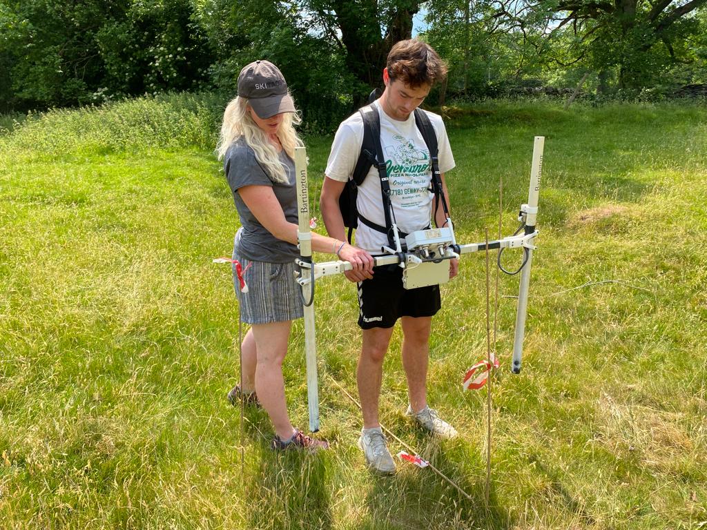 Arch_Wales's tweet photo. Our Geophysics Supervisor Jen is providing training sessions at the @StrataFloridaFS over the next few weeks. Jen led the first magnetometry session last week in glorious sunshine! https://t.co/lwnDSFBJcH