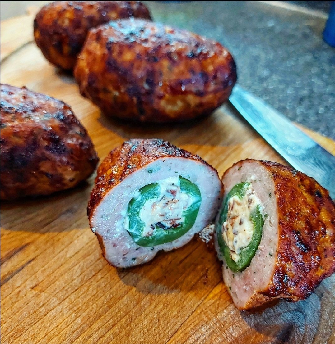 'Dino Eggs': jalapeños stuffed w/cream cheese & bacon bits, encased in sausage meat. Fresh in the case today! #AcmeMeatMarket #yegfood