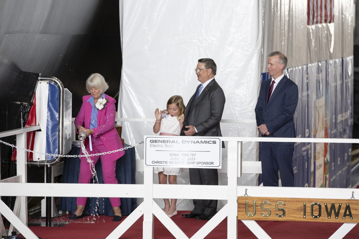 GDElectricBoat's tweet photo. The phases of the bottle break 🍾

PCU Iowa is christened! Ship Sponsor Christie Vilsack performed the bottle break that christened PCU Iowa with a bottle of sparkling wine from Fireside Winery in Marengo, Iowa. Standing alongside Christie was her Maid of Honor and granddaughter, Caroline Vilsack, @GDElectricBoat President Kevin Graney and Undersecretary of the Navy Erik Raven. 
 
Thank you to all who joined us virtually and in person to share in this historic occasion. And to our shipbuilders, thank you for your continuous hard work and dedication that made this milestone—and this magnificent submarine—possible.