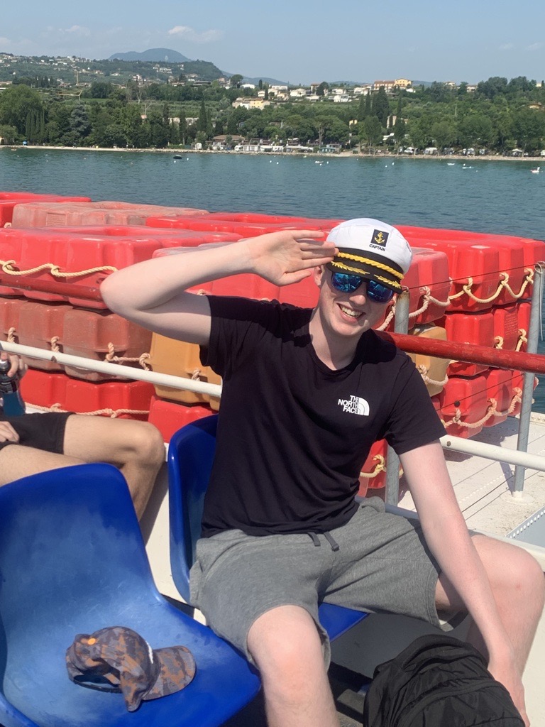 Captain Murray McD sailing the boat on Lake Garda.